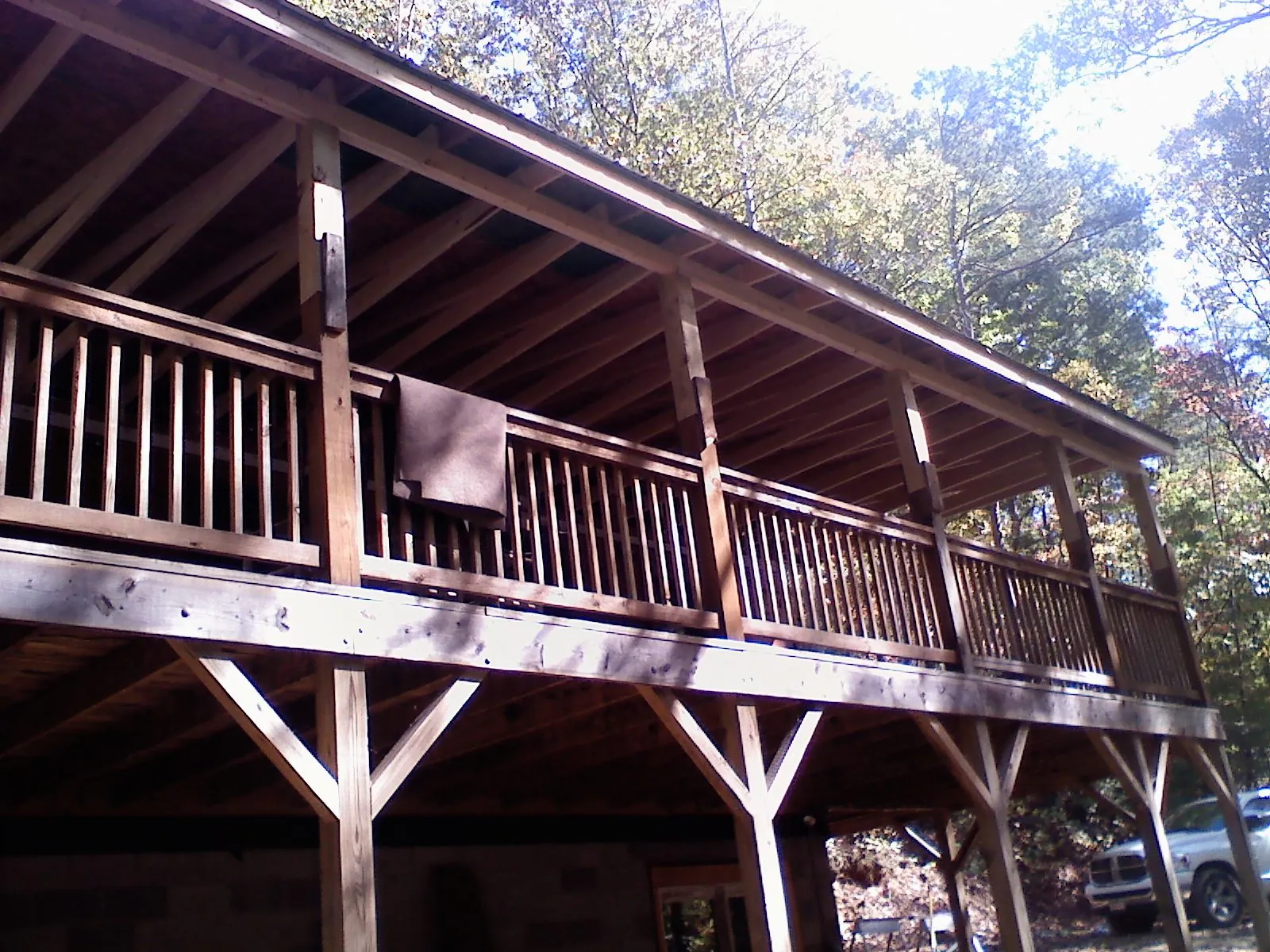 Timber framing under a new elevated porch and deck — Roof Leak Repair in Absarokee by Roofing Brothers